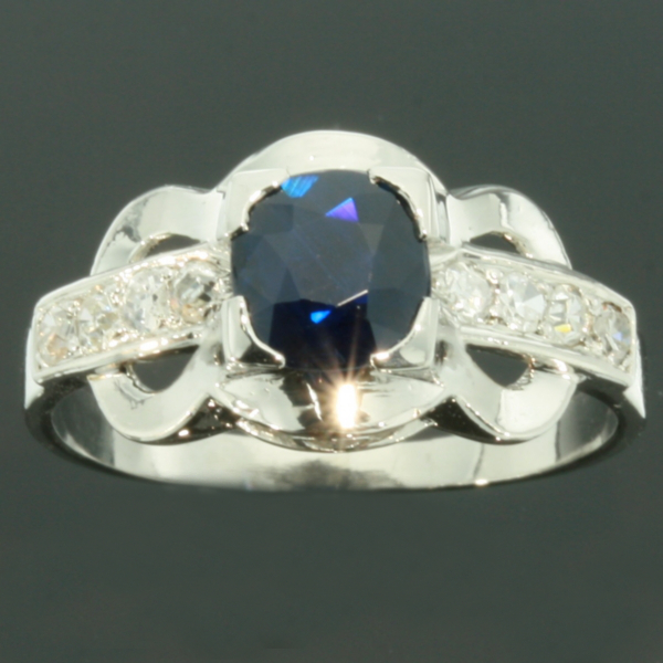 Lovely platinum estate engagement ring with charming velvetish blue sapphire